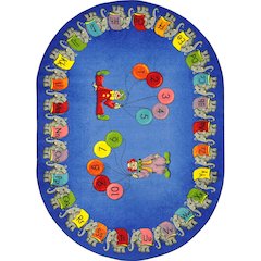 Kid Essentials Circus Elephant Parade 5'4" x 7'8" Oval Area Rug in Color Multi