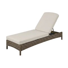 Sand-colored outdoor wicker chaise lounge with cushioned seat