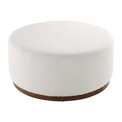 Round boucle upholstered outdoor ottoman with cushioned top, modern design