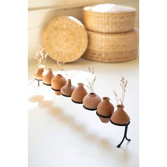 Eight Clay Vessels On An Iron Base