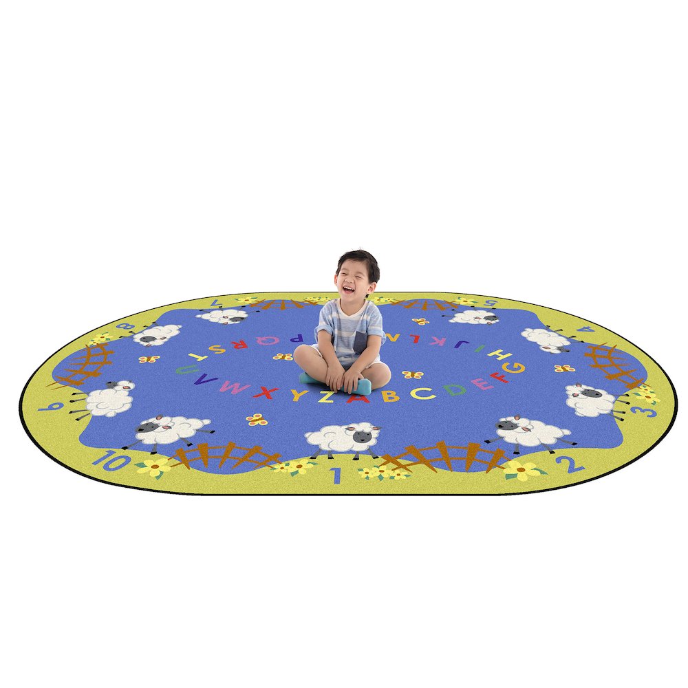 Kid Essentials Lamby Pie 7'8" x 10'9" Oval Area Rug in Color Multi. Picture 2