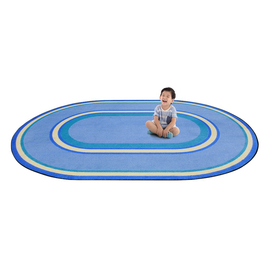 Kid Essentials Ripples 7'8" x 10'9" Oval Area Rug in Color Boy Blue. Picture 2