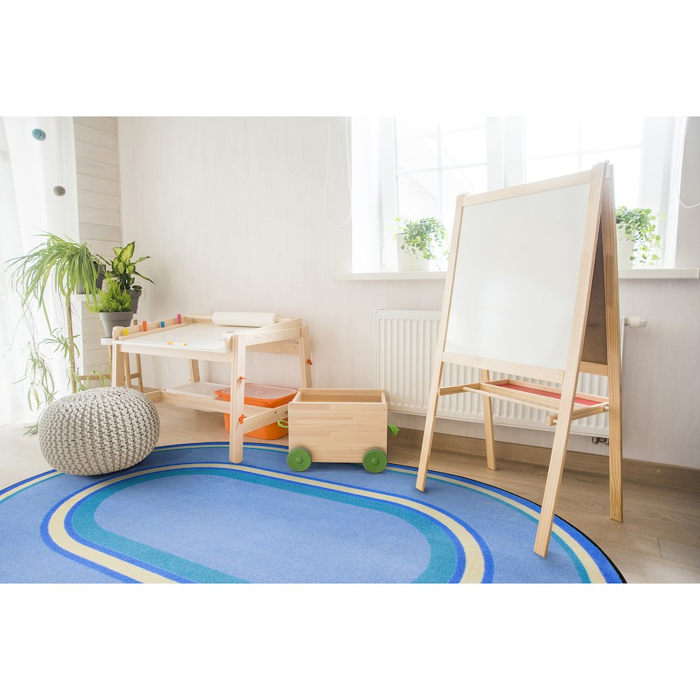 Kid Essentials Ripples 7'8" x 10'9" Oval Area Rug in Color Boy Blue. Picture 3