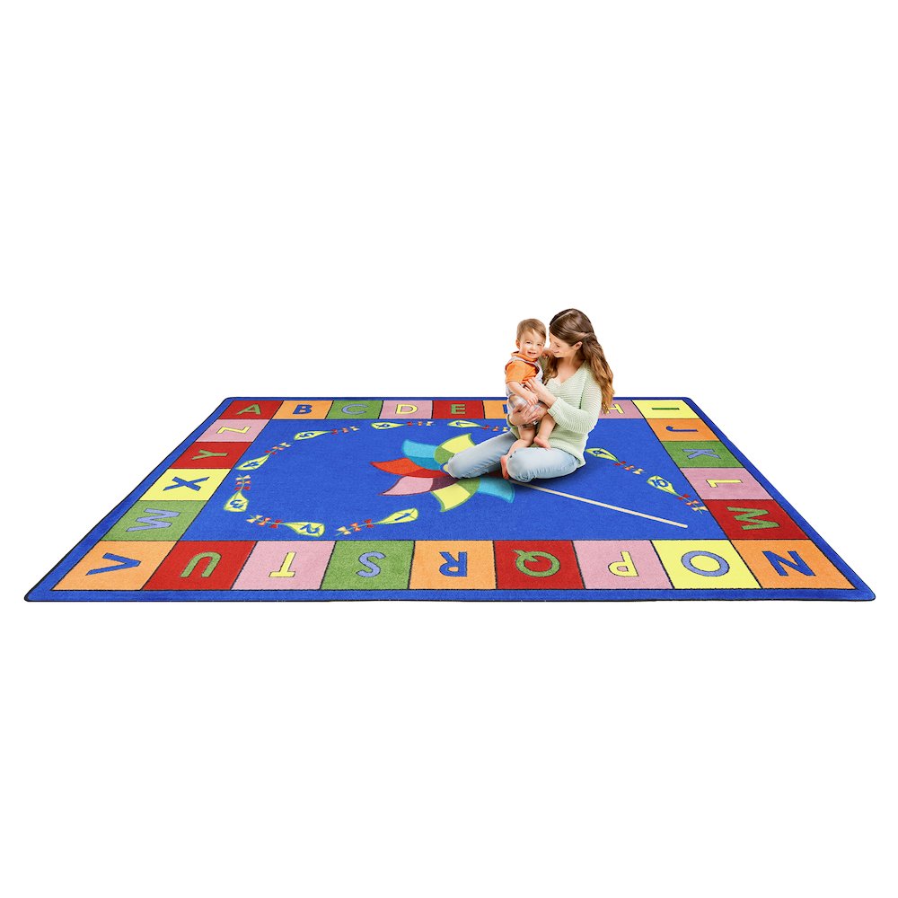 Kid Essentials Alphabet Pinwheel 5'4" x 7'8" Area Rug in Color Multi. Picture 2