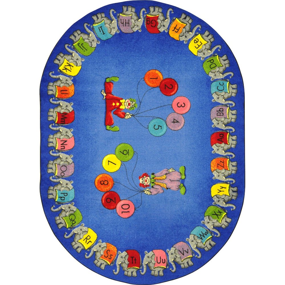 Kid Essentials Circus Elephant Parade 5'4" x 7'8" Oval Area Rug in Color Multi. Picture 1