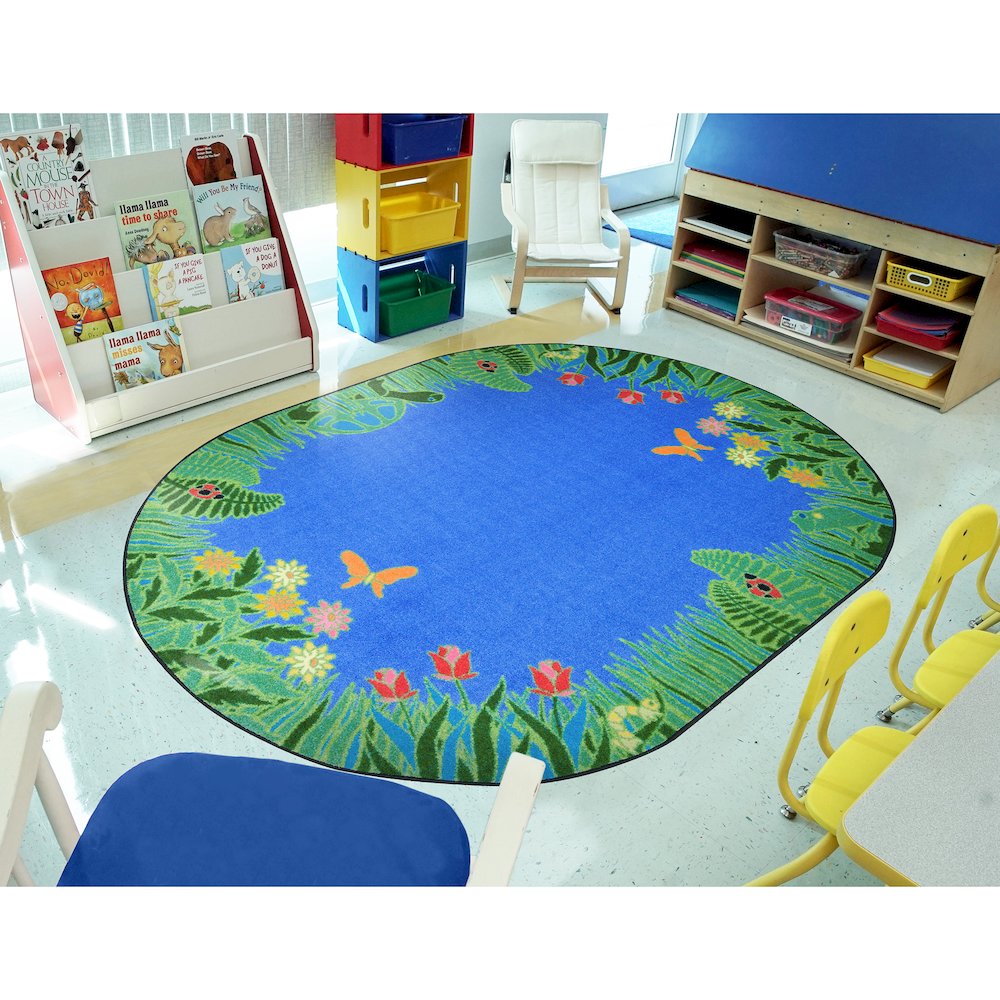 Kid Essentials Merry Meadows 7'8" x 10'9" Oval Area Rug in Color Blue. Picture 3