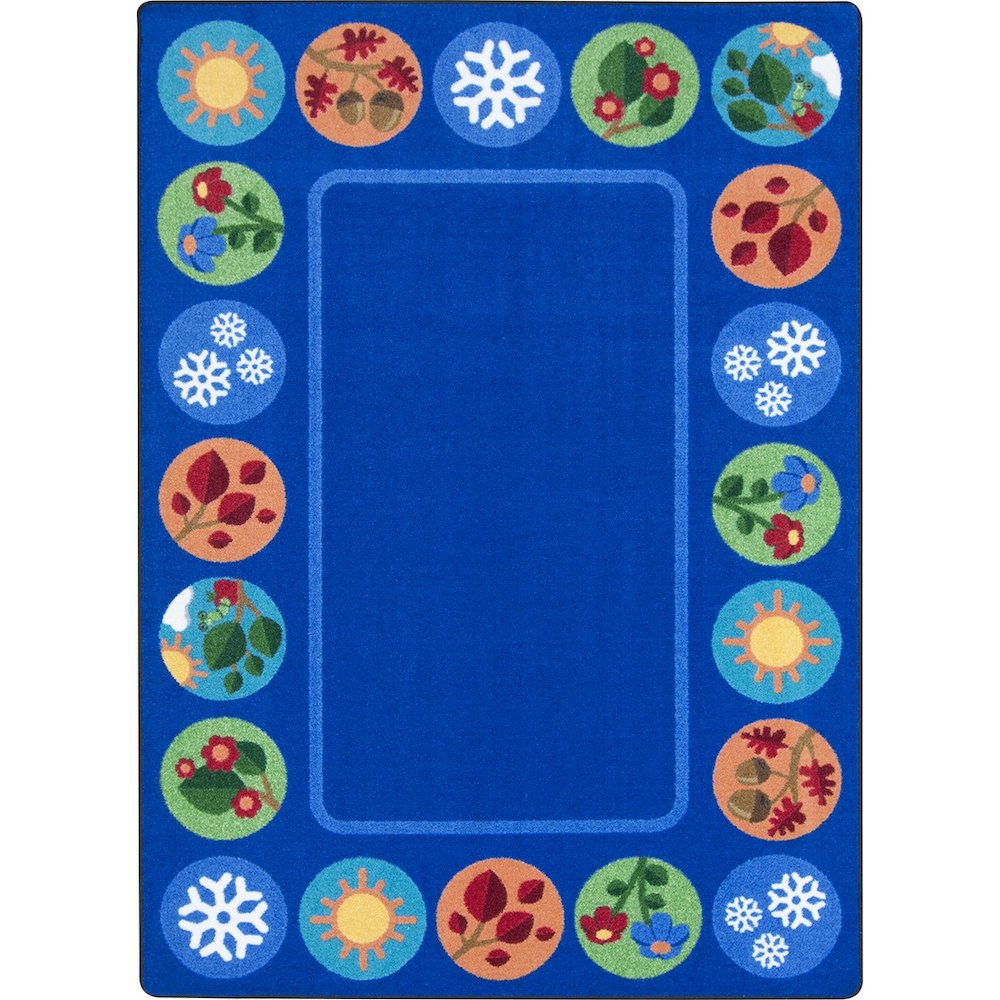 Kid Essentials Sit Around the Seasons 5'4" x 7'8" Area Rug in Color Multi. Picture 1