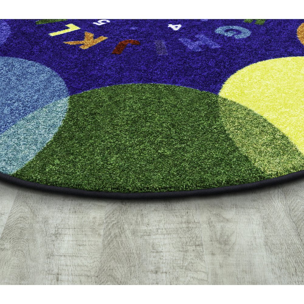 Take A Seat 5'4" x 7'8" Oval Area Rug in Color Multi. Picture 2