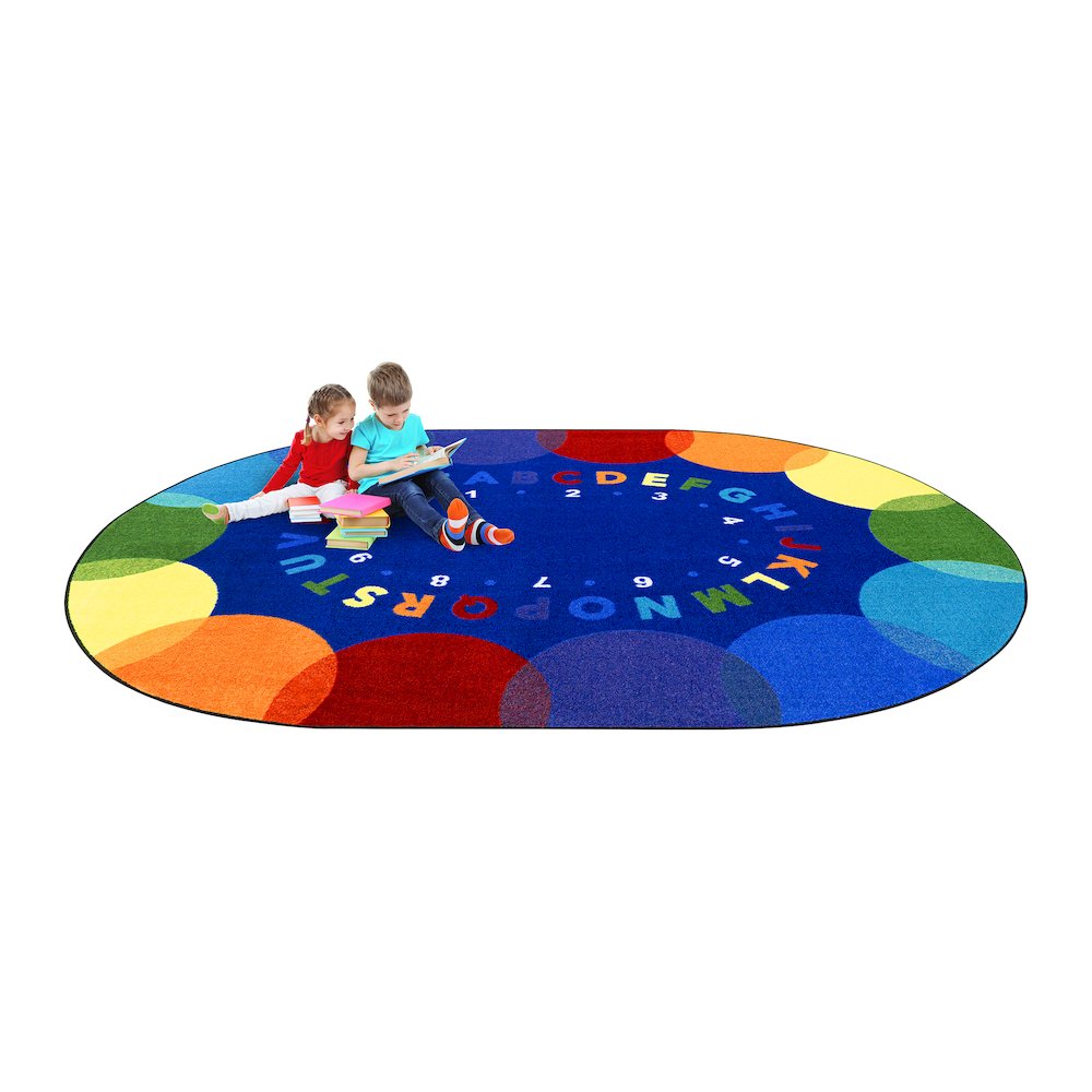 Take A Seat 5'4" x 7'8" Oval Area Rug in Color Multi. Picture 4