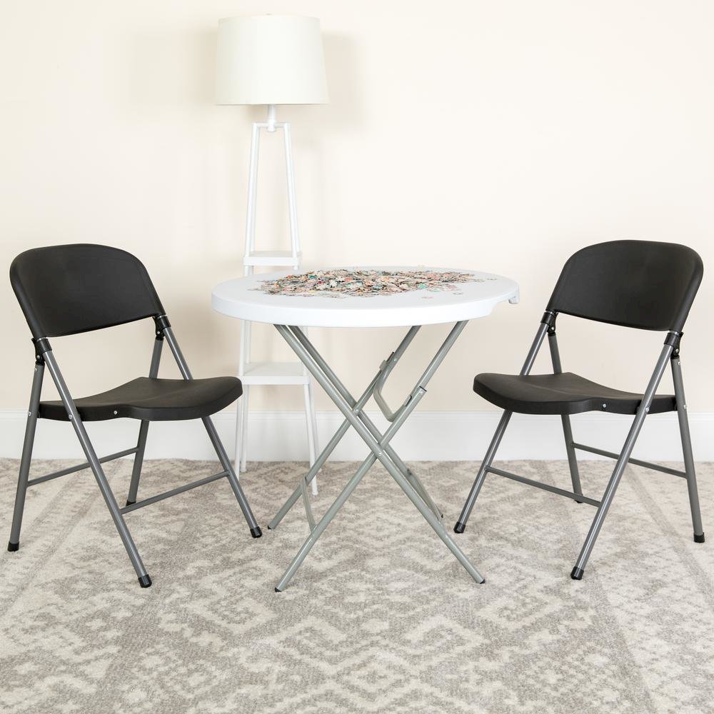 HERCULES Series 330 lb. Capacity Black Plastic Folding Chair with Charcoal Frame. Picture 2