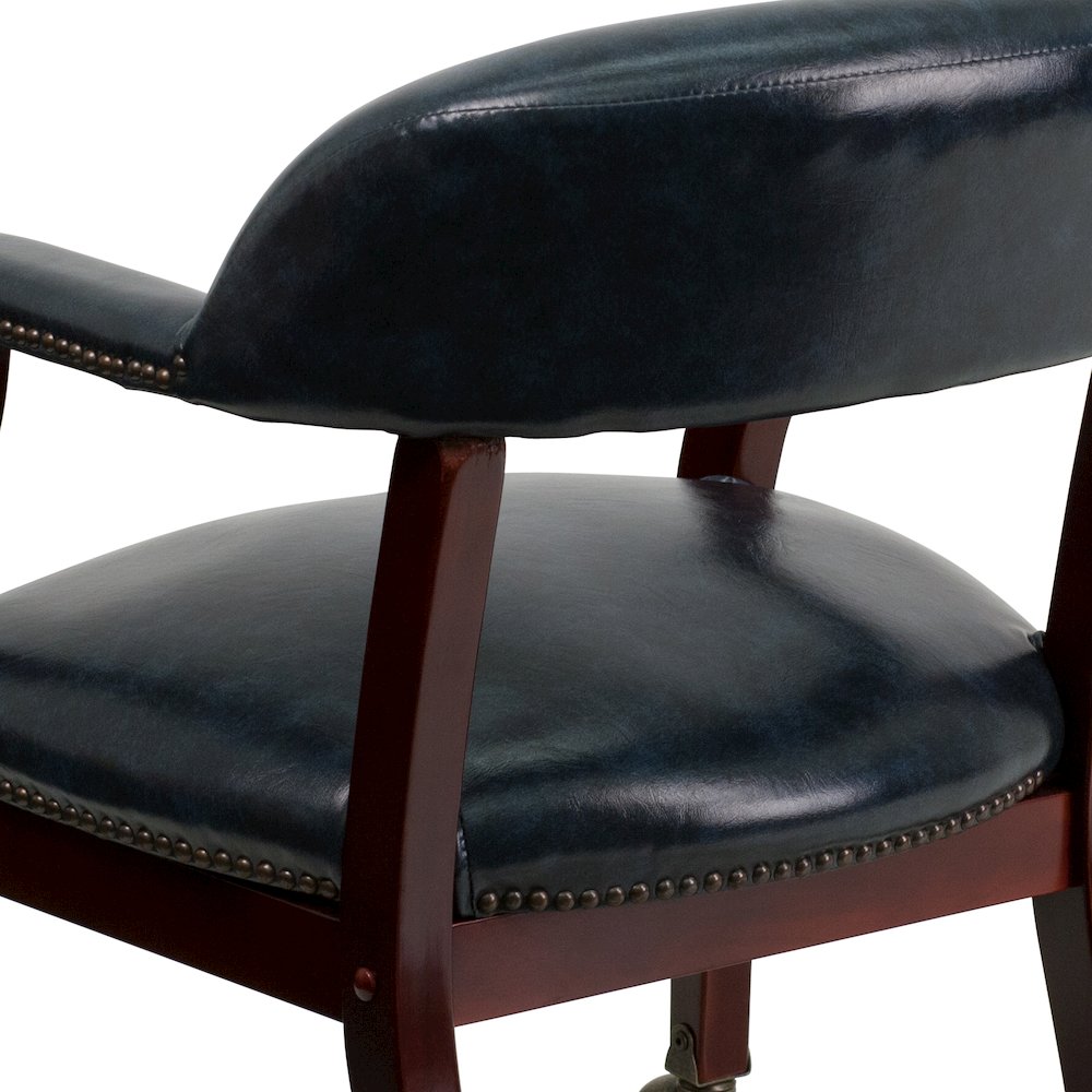 Navy Vinyl Luxurious Conference Chair with Accent Nail Trim and Casters. Picture 11