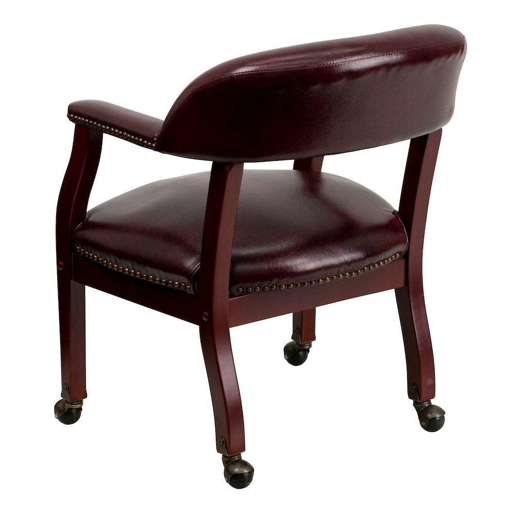 Oxblood Vinyl Luxurious Conference Chair with Accent Nail Trim and Casters. Picture 6