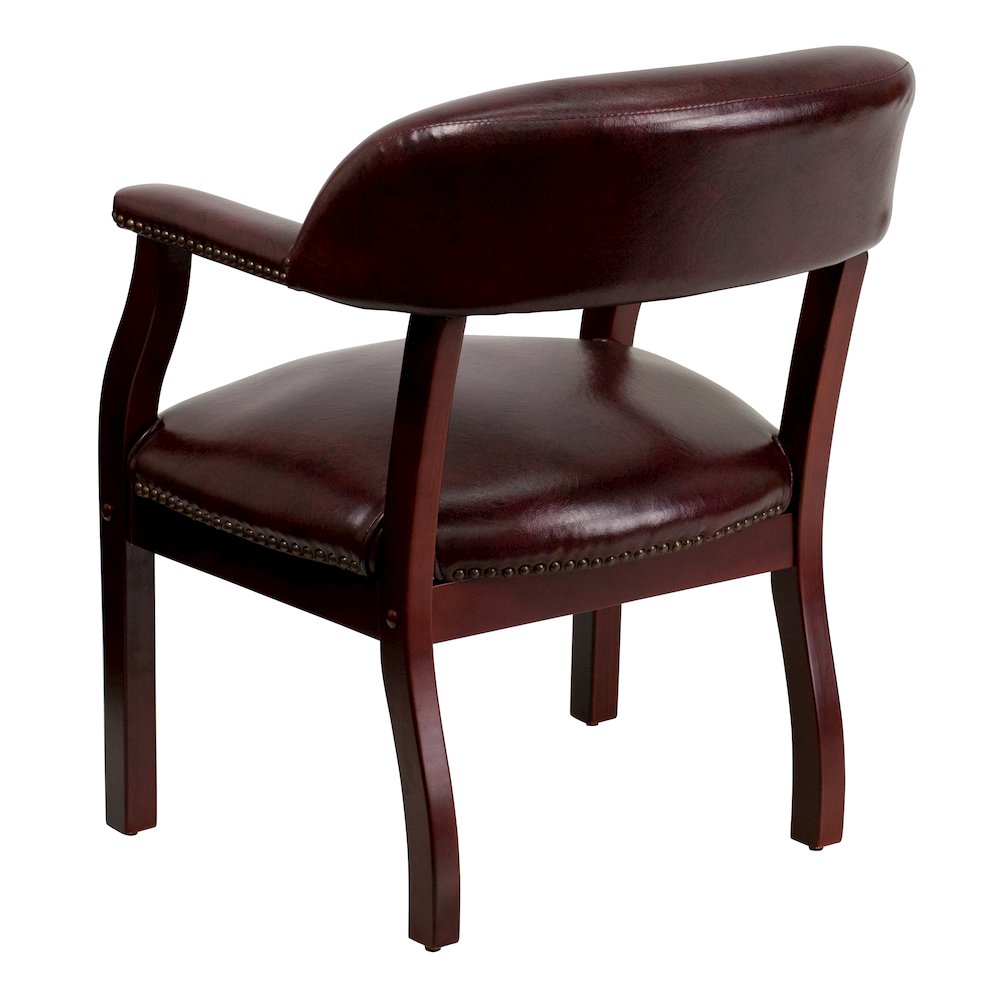 Oxblood Vinyl Luxurious Conference Chair with Accent Nail Trim. Picture 6