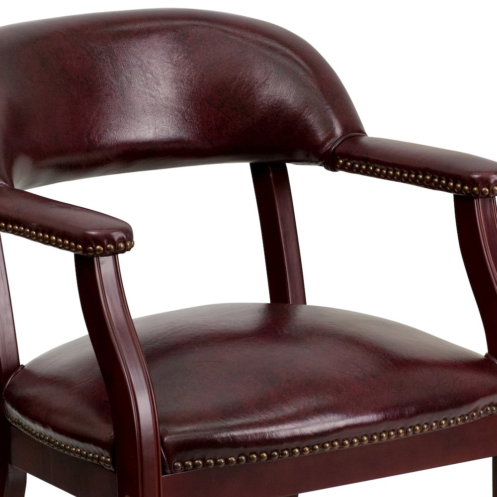 Oxblood Vinyl Luxurious Conference Chair with Accent Nail Trim. Picture 7