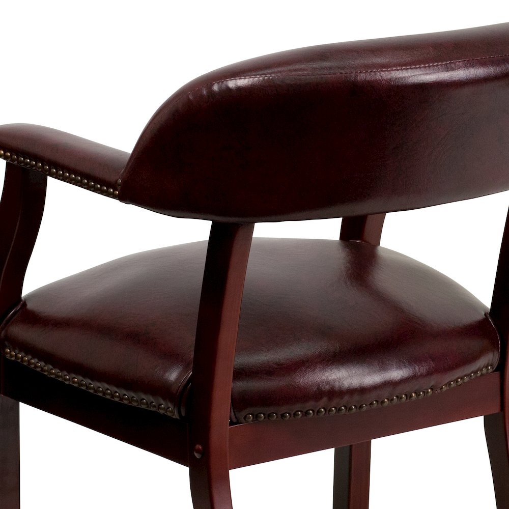 Oxblood Vinyl Luxurious Conference Chair with Accent Nail Trim. Picture 10