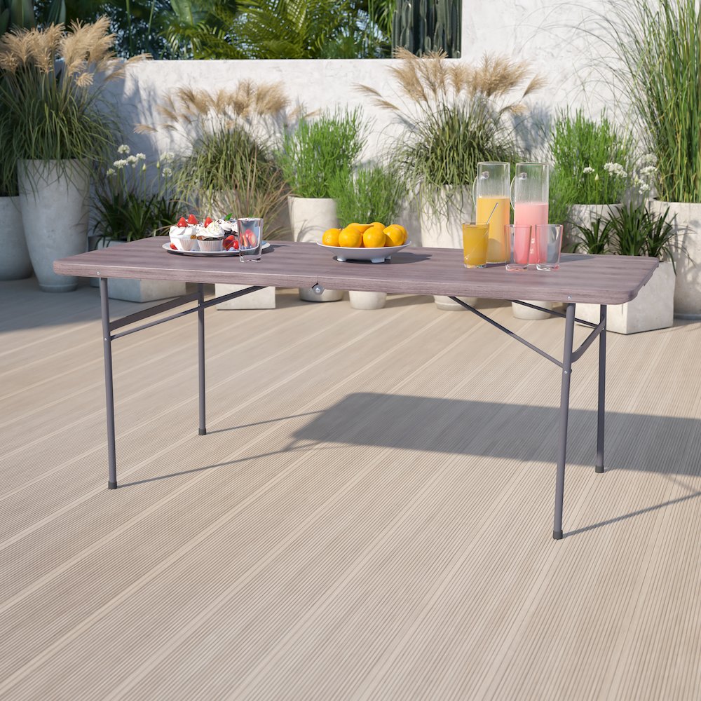 6-Foot Bi-Fold Brown Wood Grain Plastic Folding Table with Carrying Handle. Picture 2