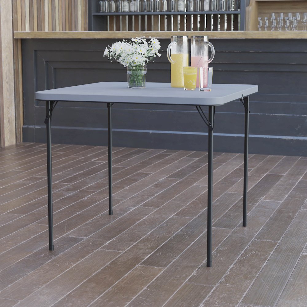 2.83-Foot Square Bi-Fold Gray Plastic Folding Table with Carrying Handle. Picture 2