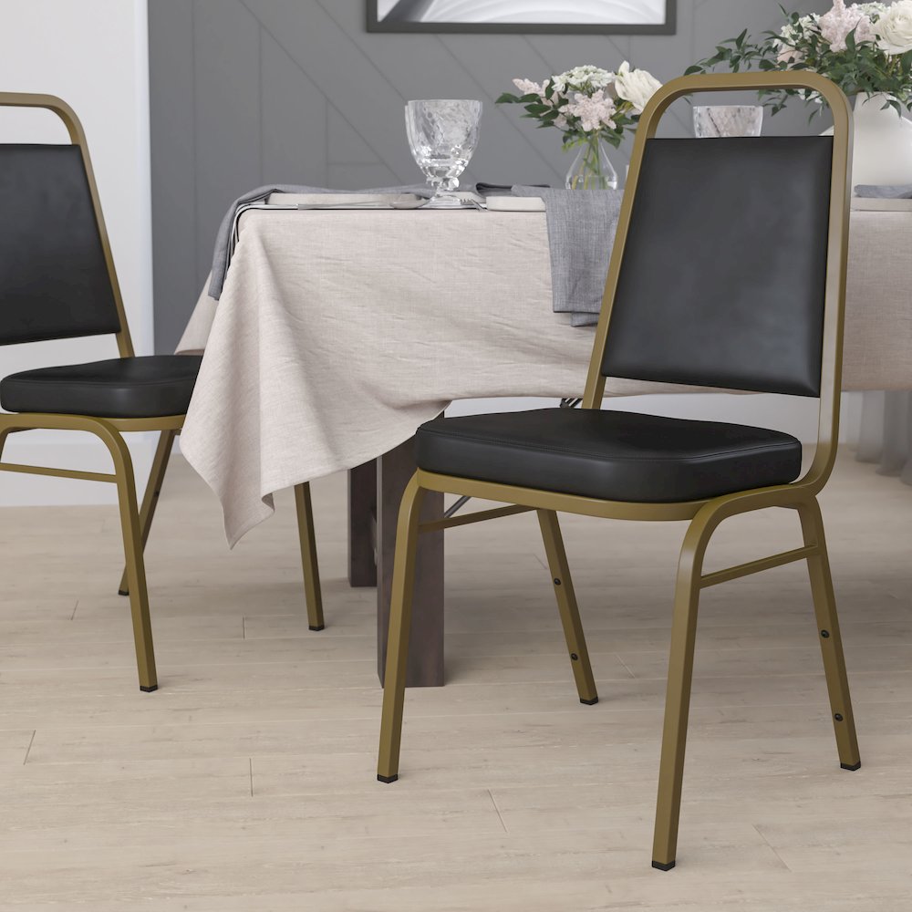 Trapezoidal Back Stacking Banquet Chair in Black Vinyl - Gold Frame. Picture 9