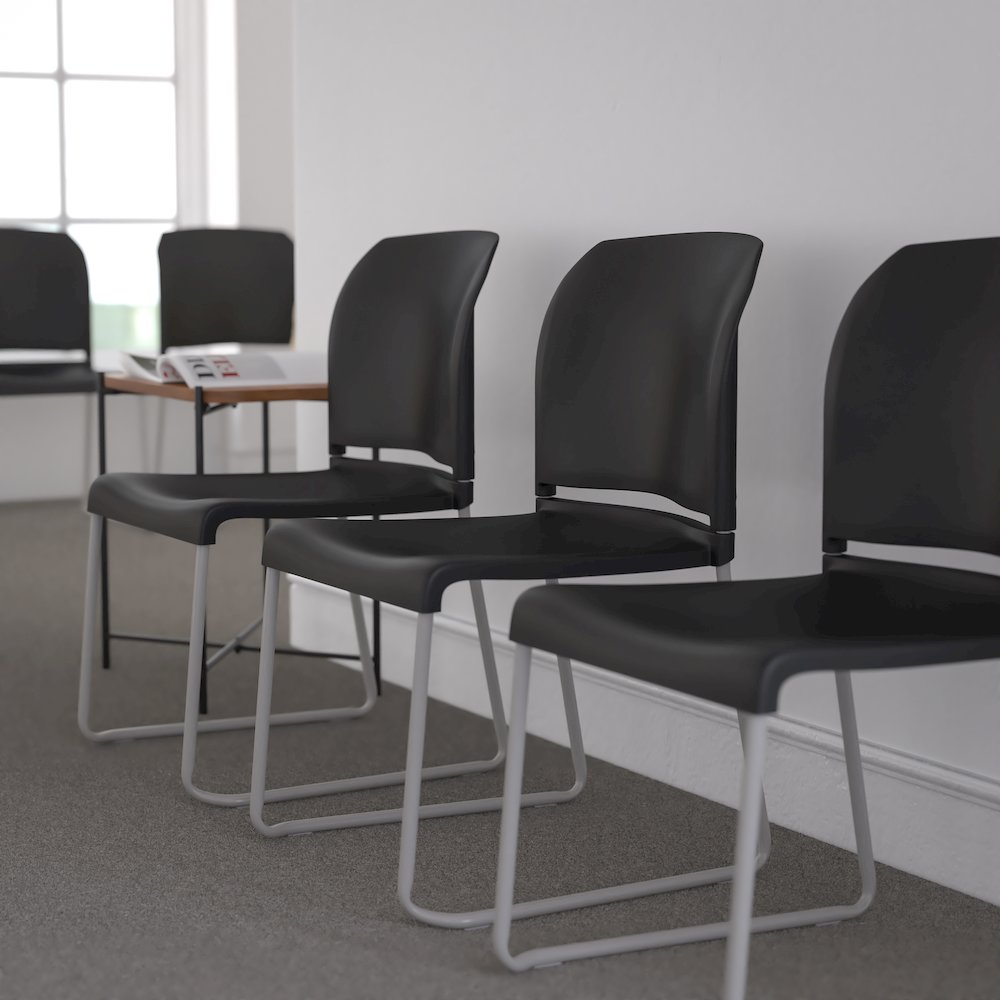 880 lb. Capacity Black Full Back Contoured Stack Chair with Gray Powder Coated Sled Base. Picture 9