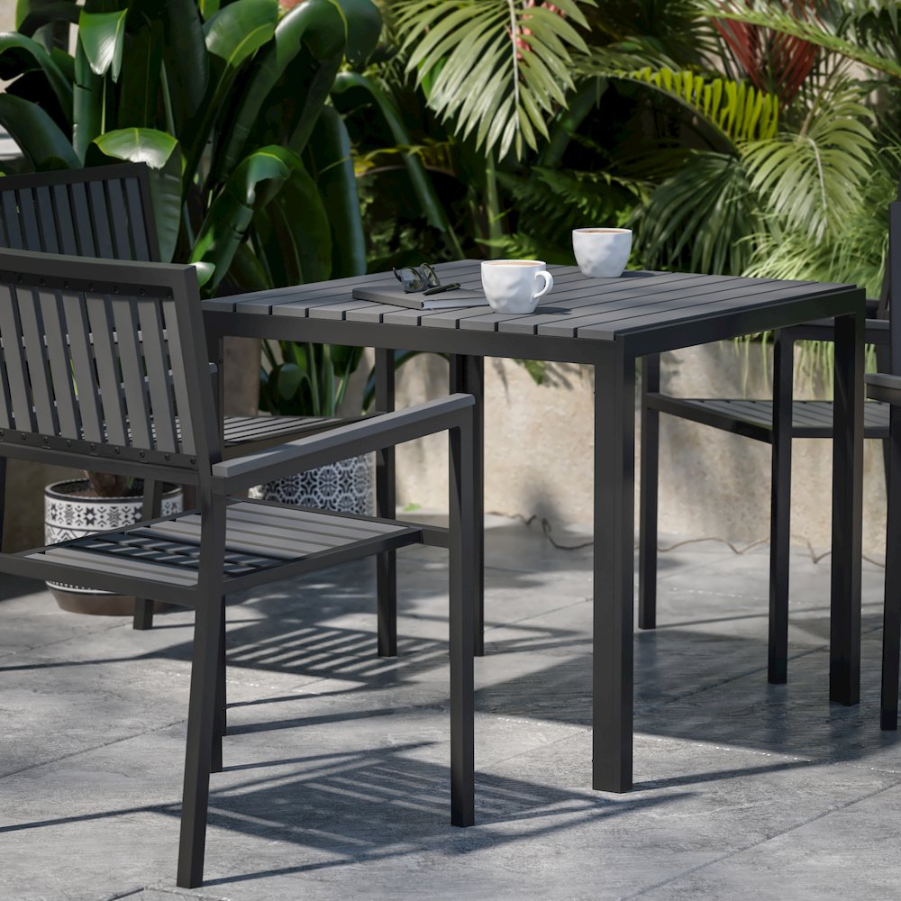 5 Piece Table and Chairs with Black Poly Resin Slatted Backs and Seats. Picture 7