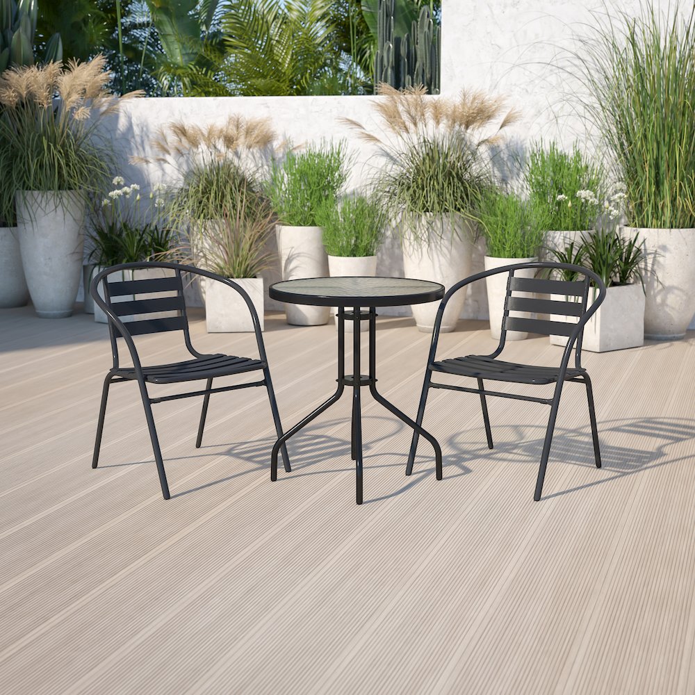 23.75'' Round Glass Metal Table with 2 Black Metal Aluminum Slat Stack Chairs. Picture 2