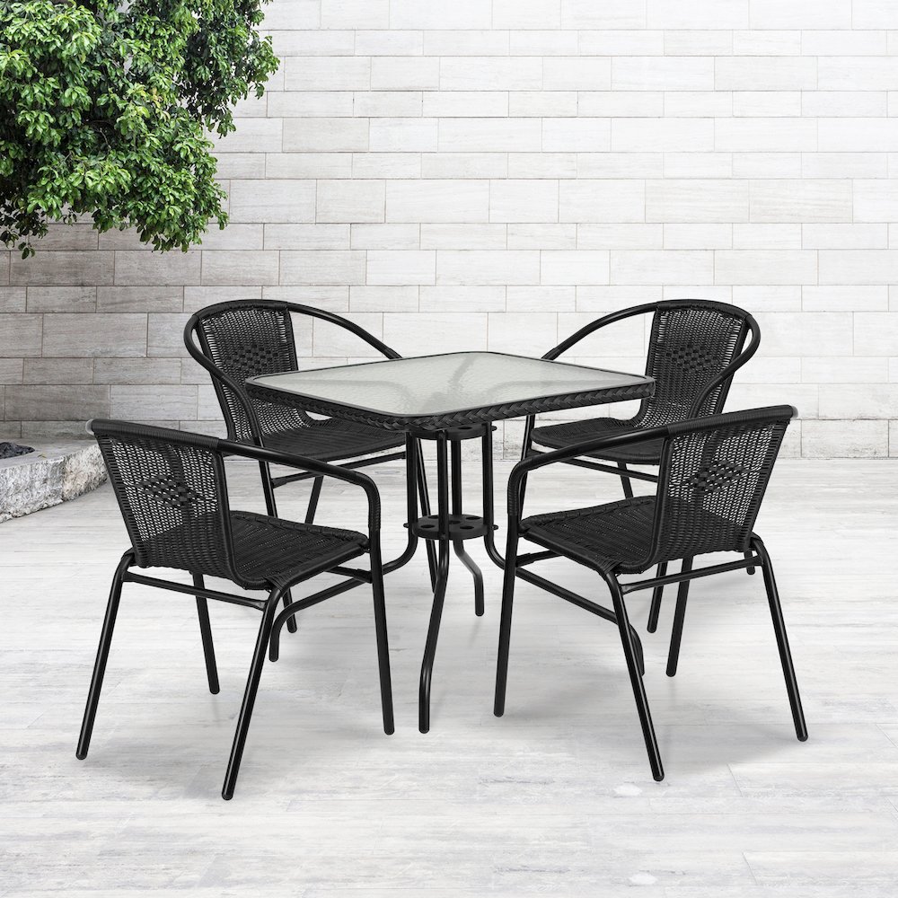 28'' Glass Metal Table with Black Rattan Edging and 4 Black Rattan Stack Chairs. Picture 2