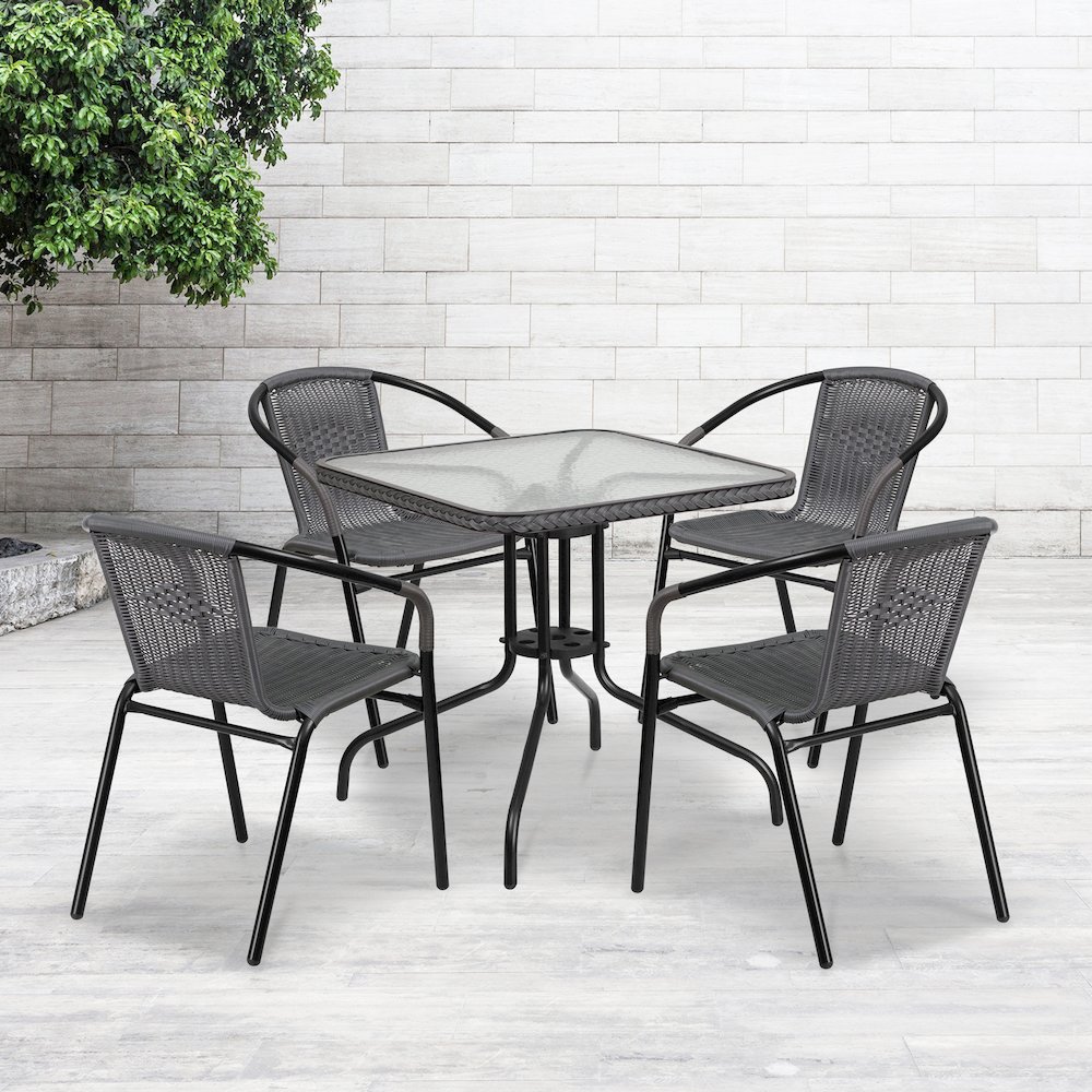 28'' Glass Metal Table with Gray Rattan Edging and 4 Gray Rattan Stack Chairs. Picture 2