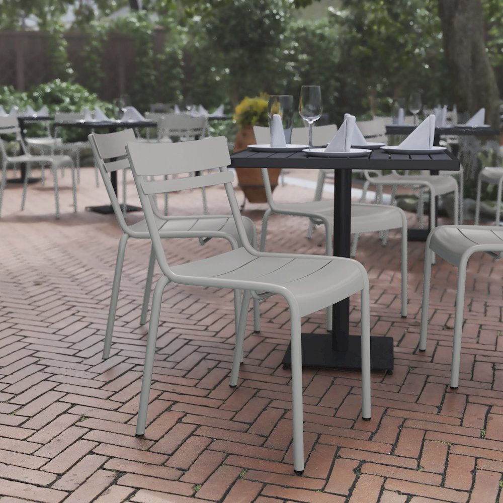 Modern Commercial Grade Indoor/Outdoor Armless Steel Stack Chair. Picture 2