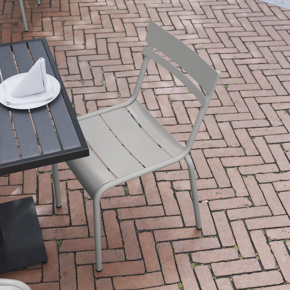 Modern Commercial Grade Indoor/Outdoor Armless Steel Stack Chair. Picture 6