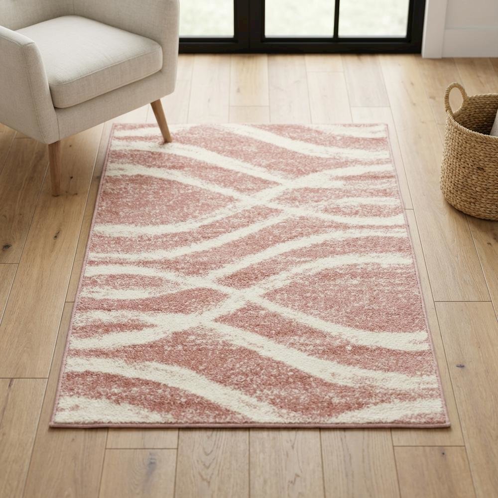 Cream and rose area rug with power loomed polypropylene pile in accent shape. Picture 3