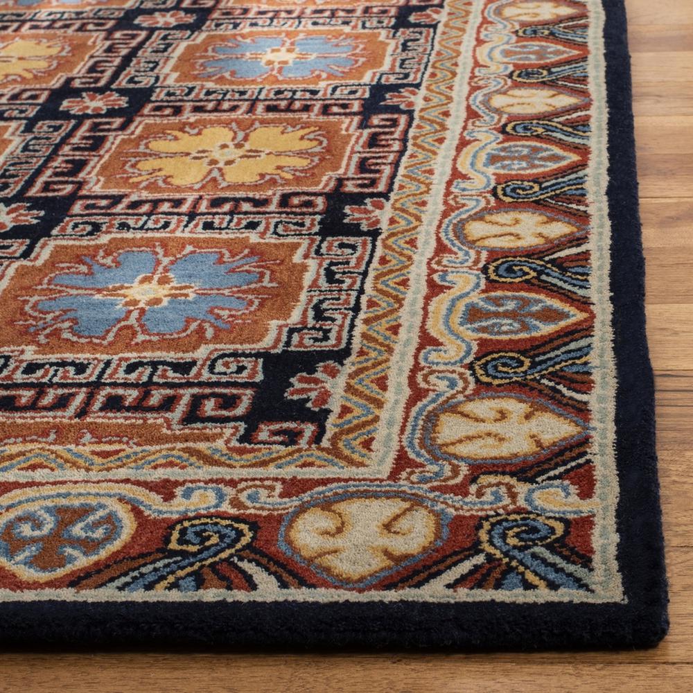 HERITAGE, NAVY / ORANGE, 5' X 8', Area Rug. Picture 1