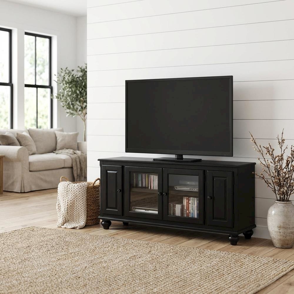 Black wood TV stand with spacious surface and modern design. Picture 2