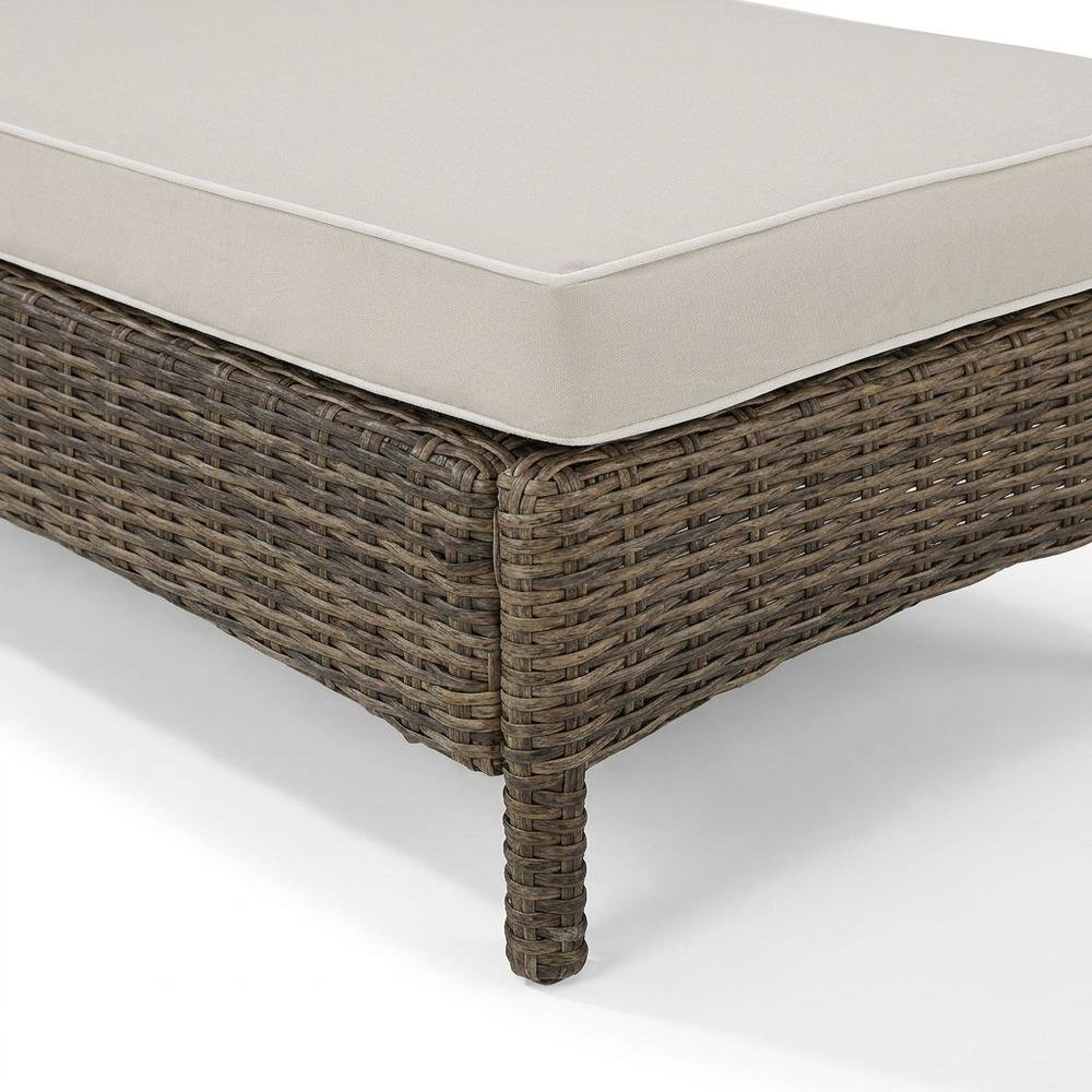 Sand-colored outdoor wicker chaise lounge with cushioned seat. Picture 6