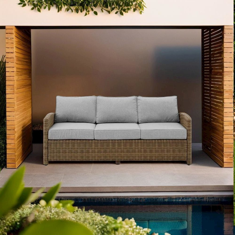 Elegant Beige Outdoor Sofa with All-Weather Resin Wicker Design. Picture 5