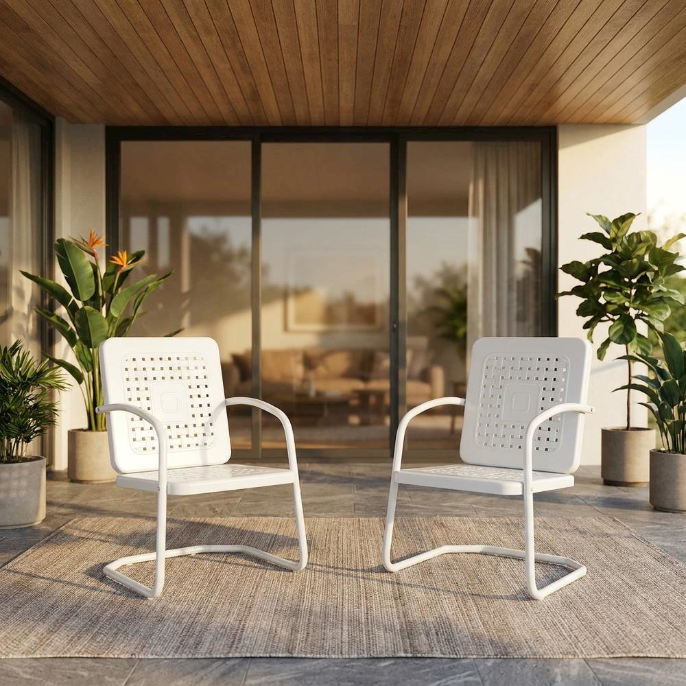 White outdoor armchair duo with sturdy construction and comfortable seating. Picture 3