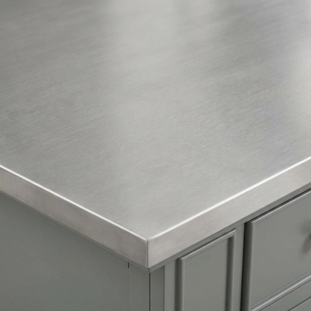 Gray kitchen island with stainless steel accents and anti-tip safety. Picture 6