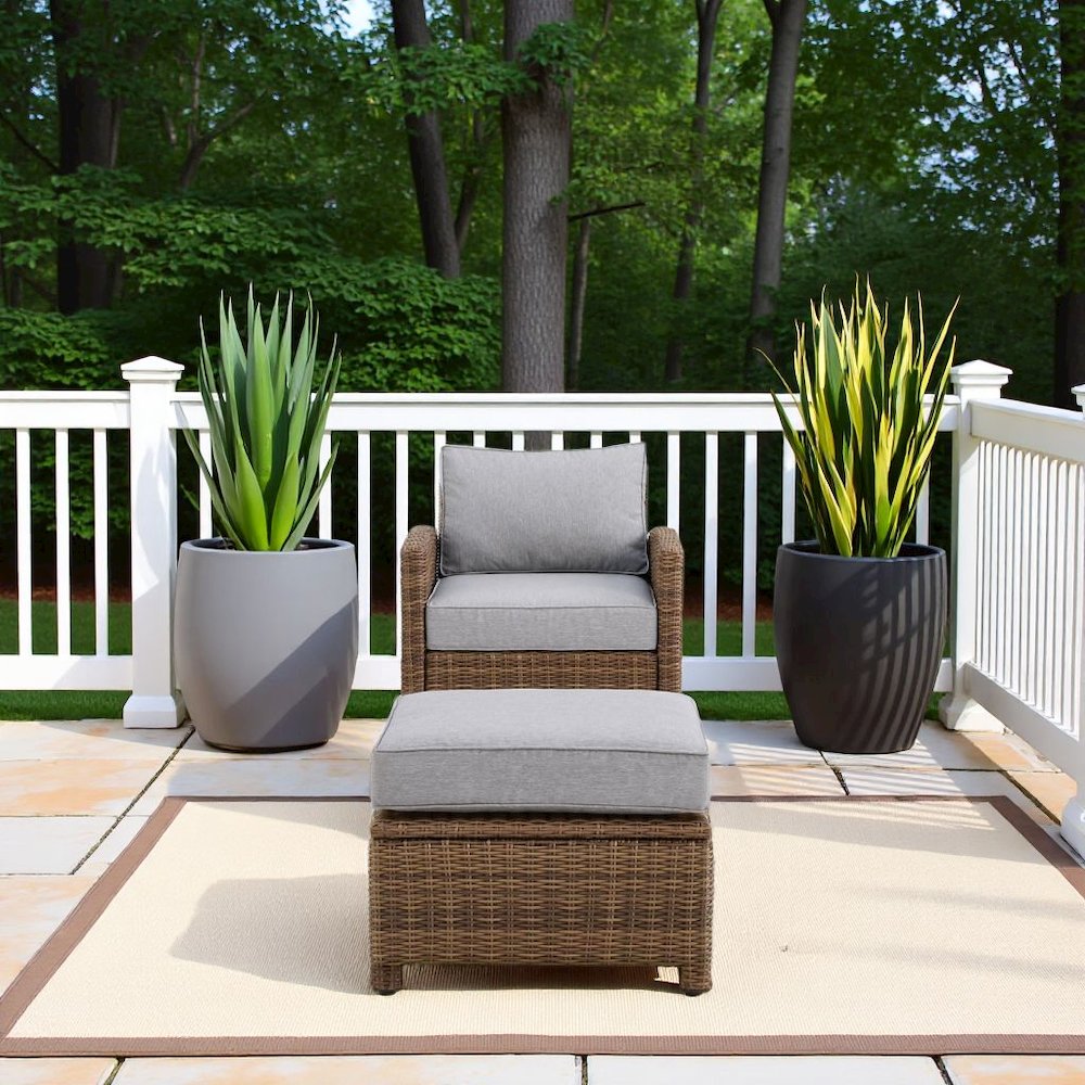 Wicker Outdoor Chair and Ottoman Set with Gray Cushions for Patio Relaxation. Picture 2