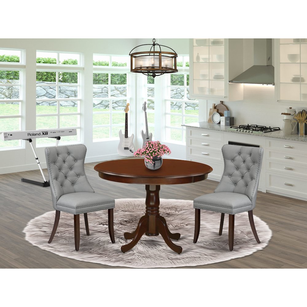 3 Piece Dining Set Consists of a Round Kitchen Table with Pedestal. Picture 2