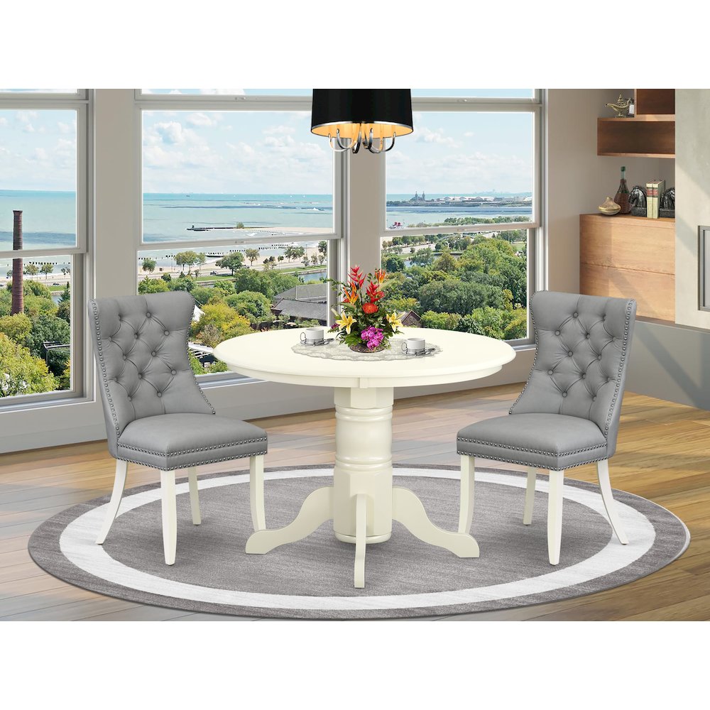 3 Piece Dinette Set Consists of a Round Kitchen Table with Pedestal. Picture 2