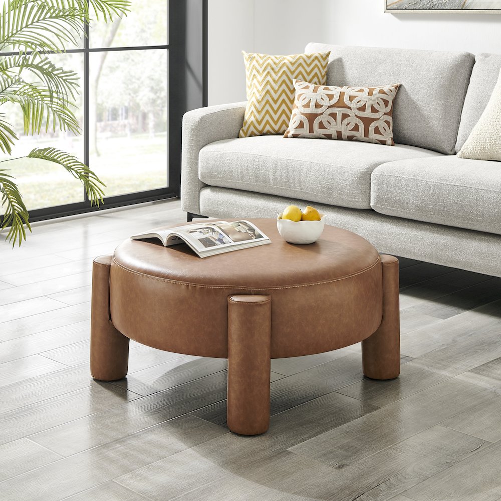 Elora Faux Leather Round Ottoman. Picture 7