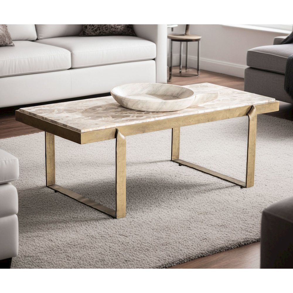 Rhodes 49" Coffee Table with Capri Beige Marble Top and Antique Brass Base. Picture 5