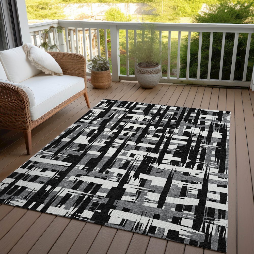 Machine Washable Indoor/Outdoor Chantille Black 5' x 7'6" Rug. Picture 7