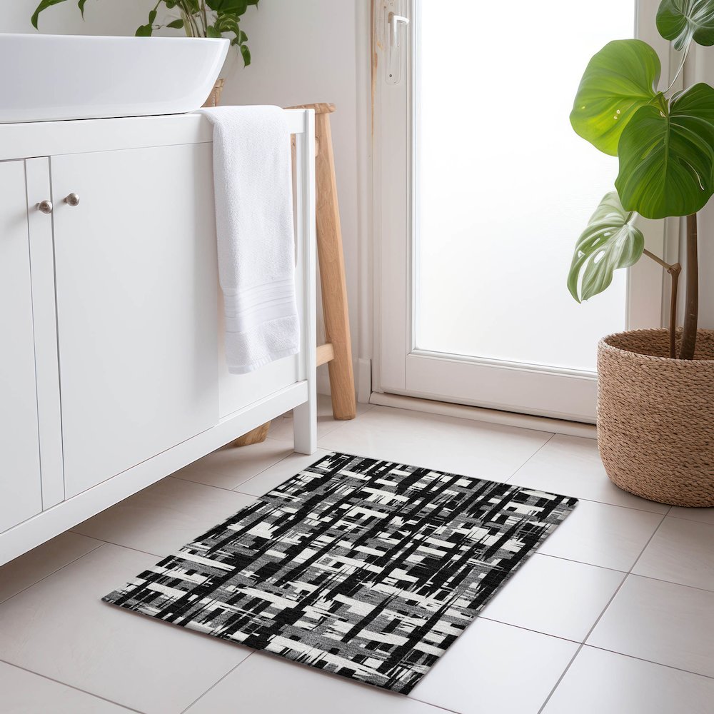 Machine Washable Indoor/Outdoor Chantille Black 1'8" x 2'6" Rug. Picture 5