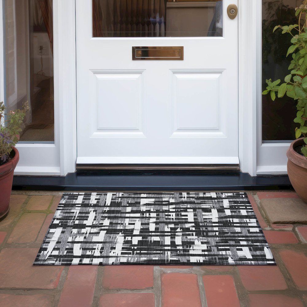 Machine Washable Indoor/Outdoor Chantille Black 1'8" x 2'6" Rug. Picture 6