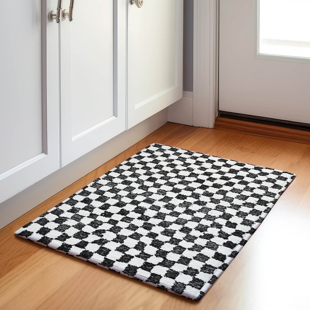 Machine Washable Indoor/Outdoor Chantille Black 1'8" x 2'6" Rug. Picture 5