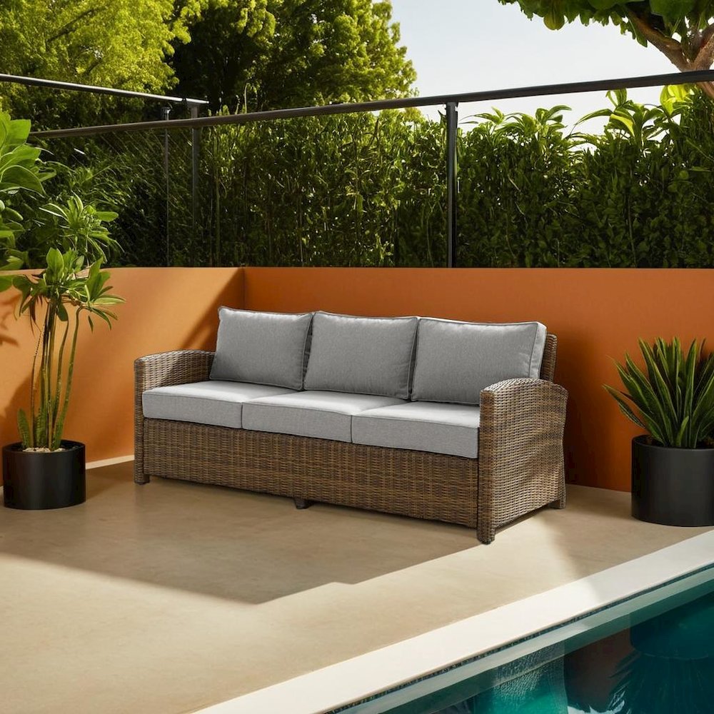 Elegant Gray Wicker Outdoor Sofa with Weather-Resistant Cushion Covers. Picture 6