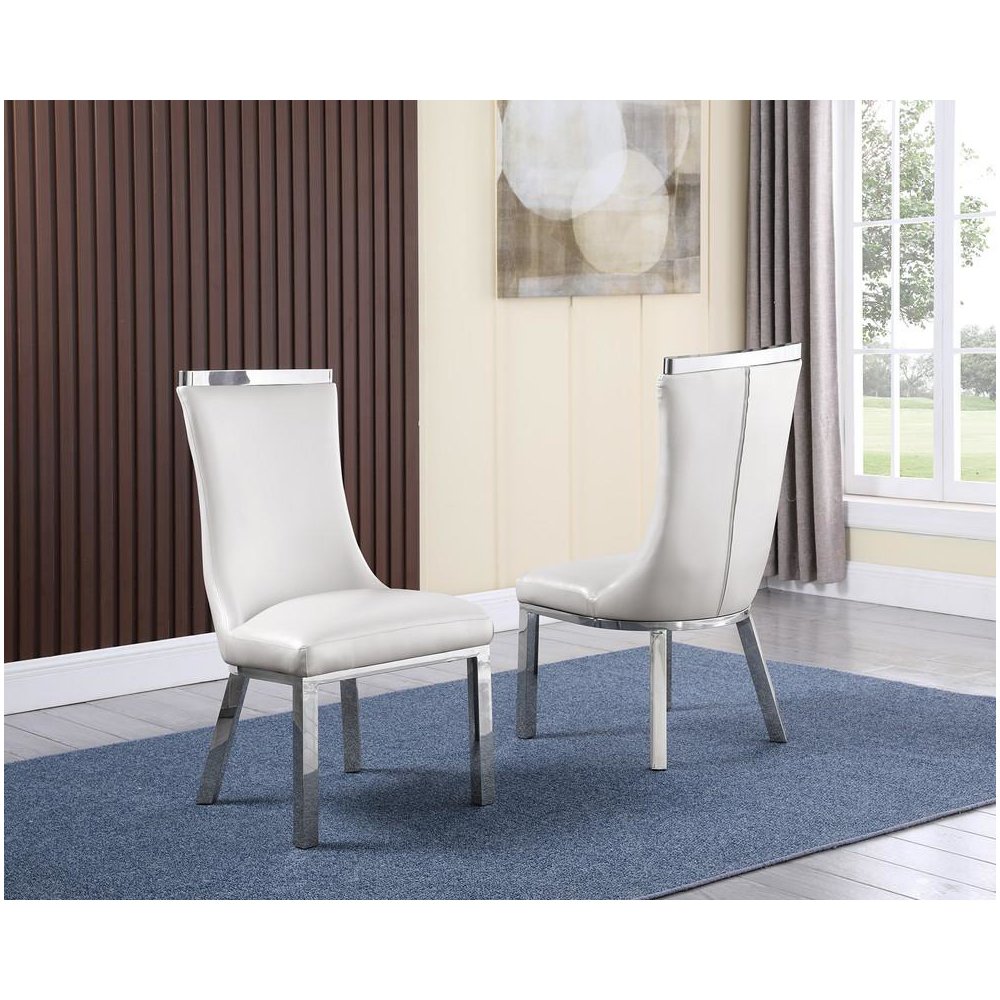 Upholstered dining chiars set of 2 in White faux leather with stainless steel base. Picture 1