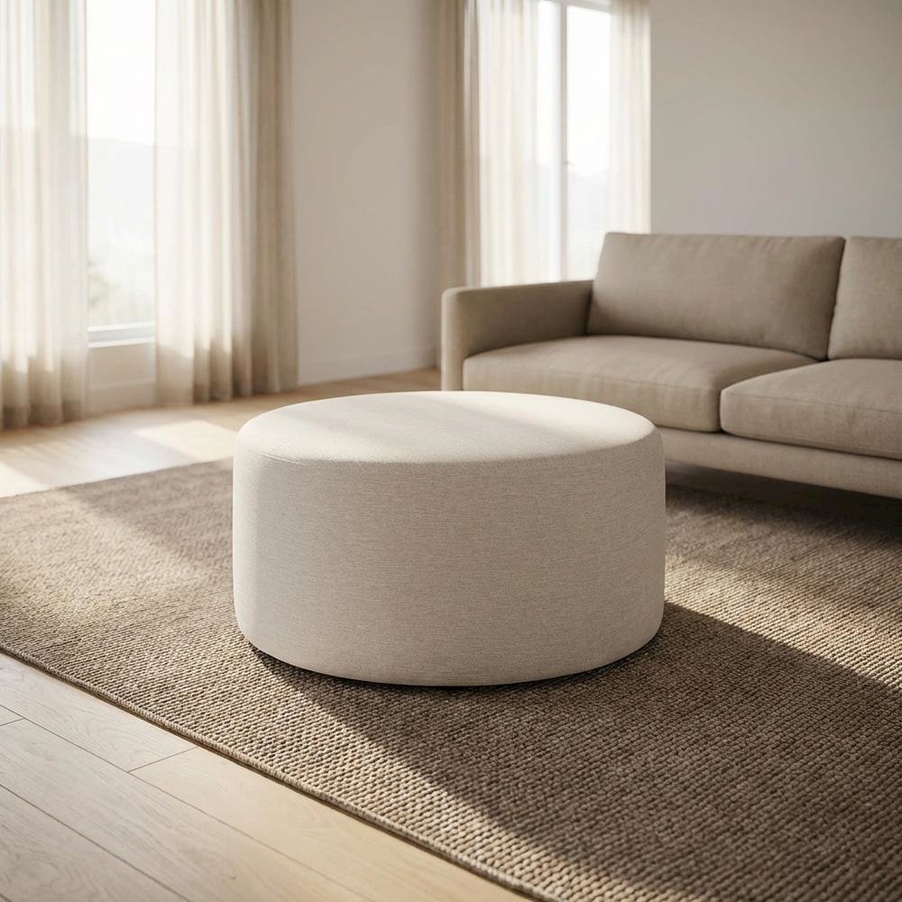 Round Heathered Fabric Upholstered Ottoman for Outdoor Spaces. Picture 2