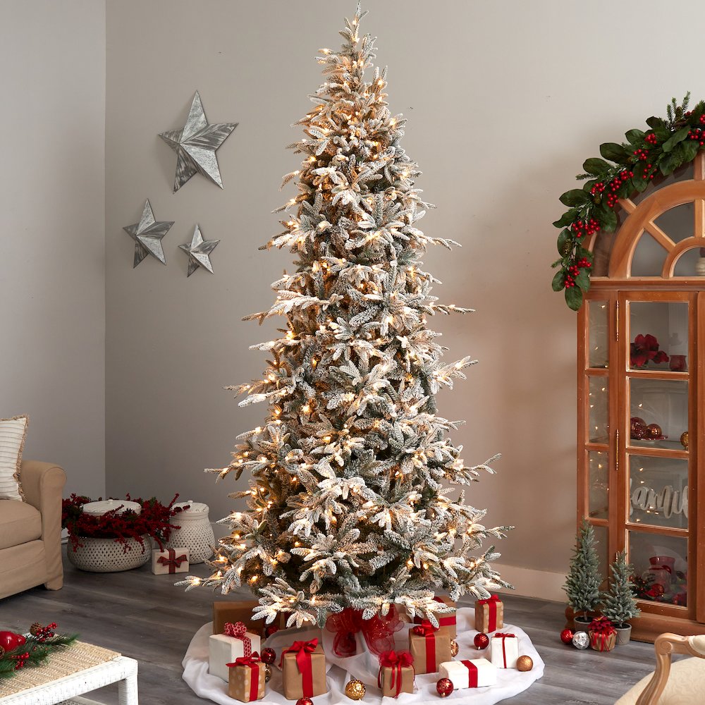 9.5ft. Flocked Manchester Spruce Artificial Christmas Tree with 650 Lights. Picture 7