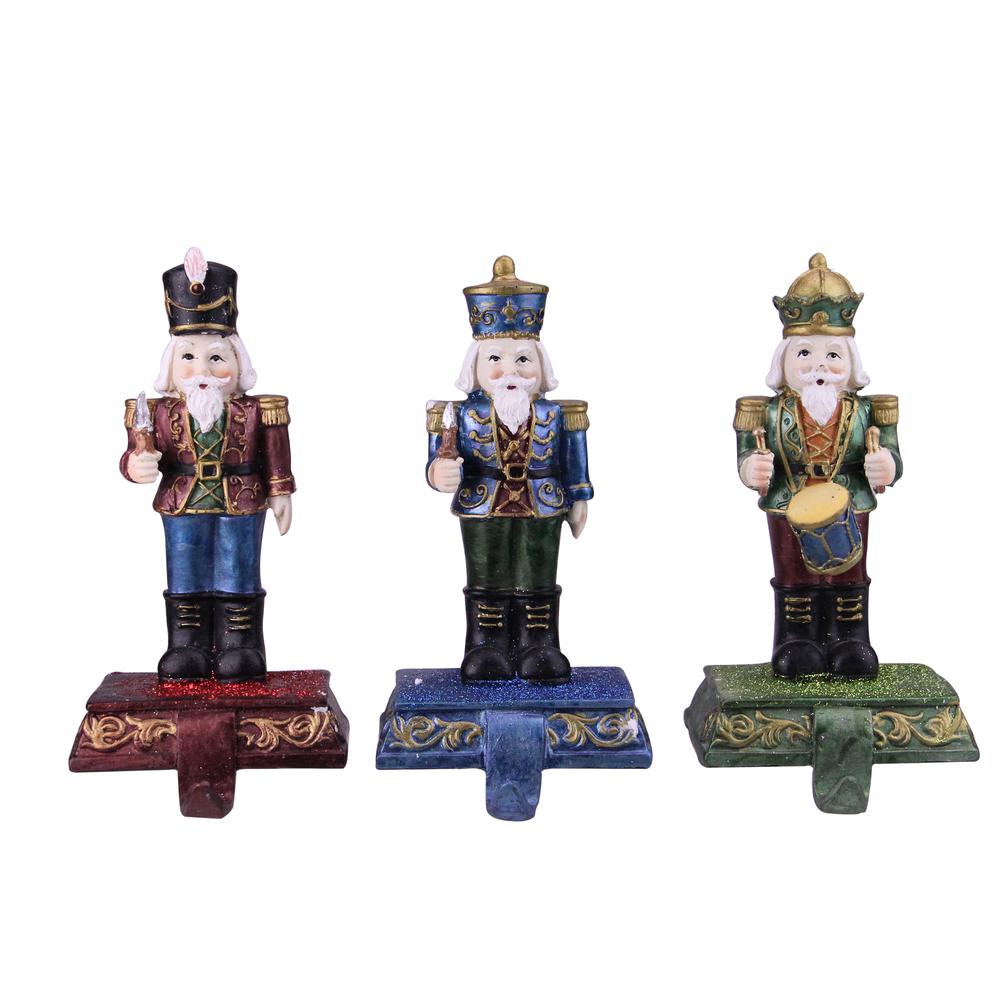 Set of 3 Blue  Red and Green Glittered Nutcracker Stocking Holders 7.75". Picture 1